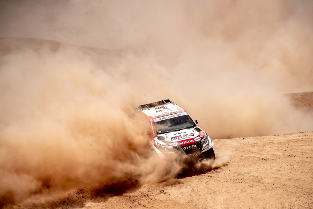 Rally car drifting in the desert